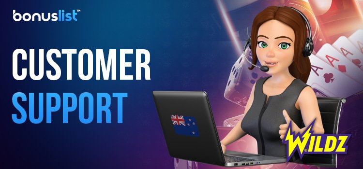 A Wildz Casino customer care representative is providing support with a laptop.